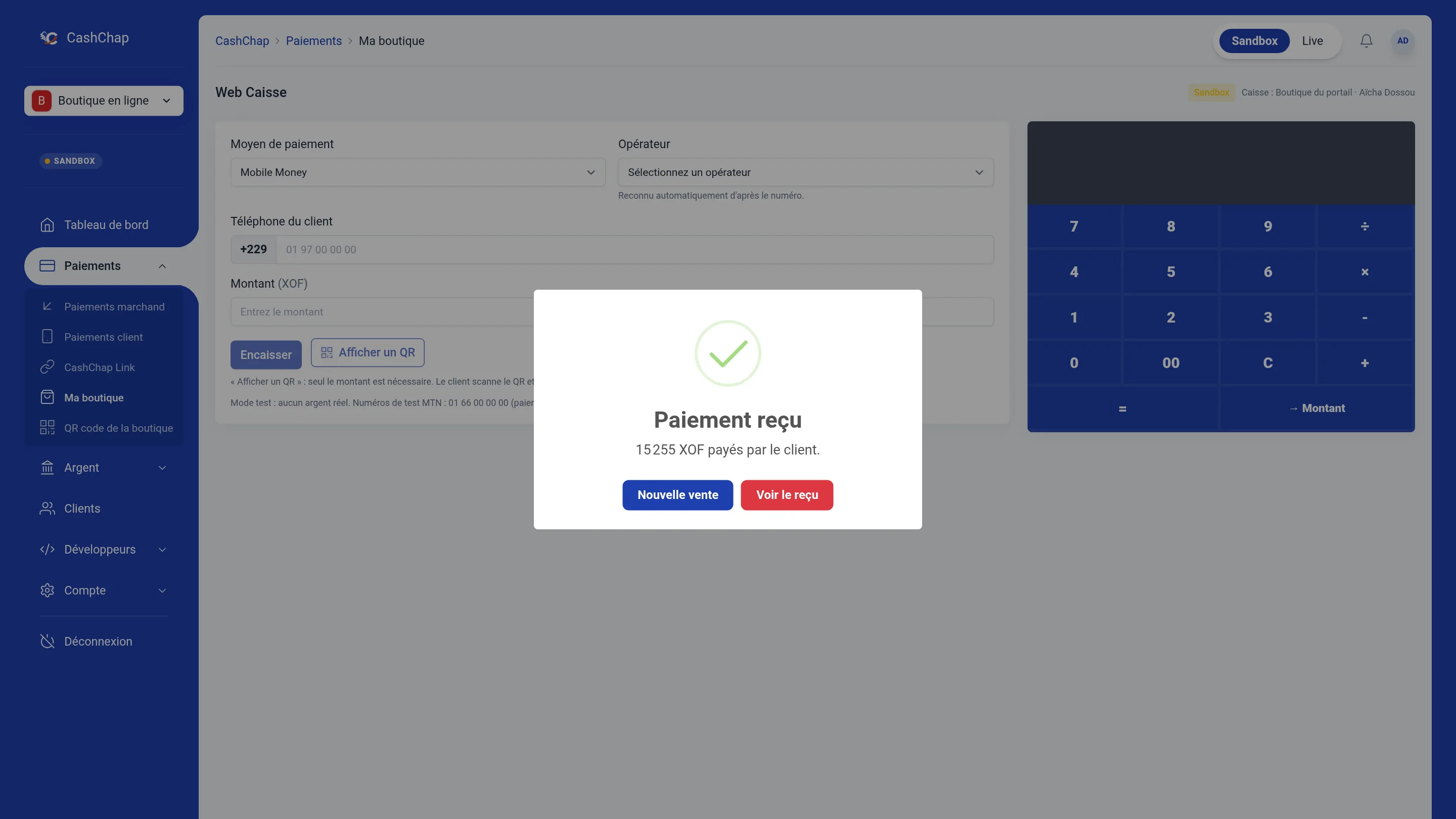 Portail en mode Sandbox, page Web Caisse : fenêtre Paiement reçu avec une coche verte, « 15 255 XOF payés par le client. » et les boutons Nouvelle vente et Voir le reçu.